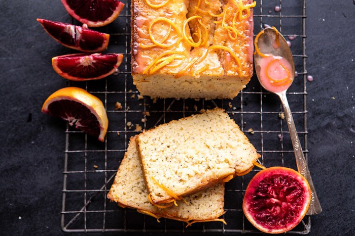 horizontal photo of Lemon Poppyseed Cake with Citrus Honey Glaze with 2 pieces of cake cut