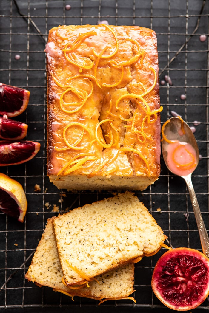 overhead photo of Lemon Poppyseed Cake with Citrus Honey Glaze and 2 pieces of cake cut