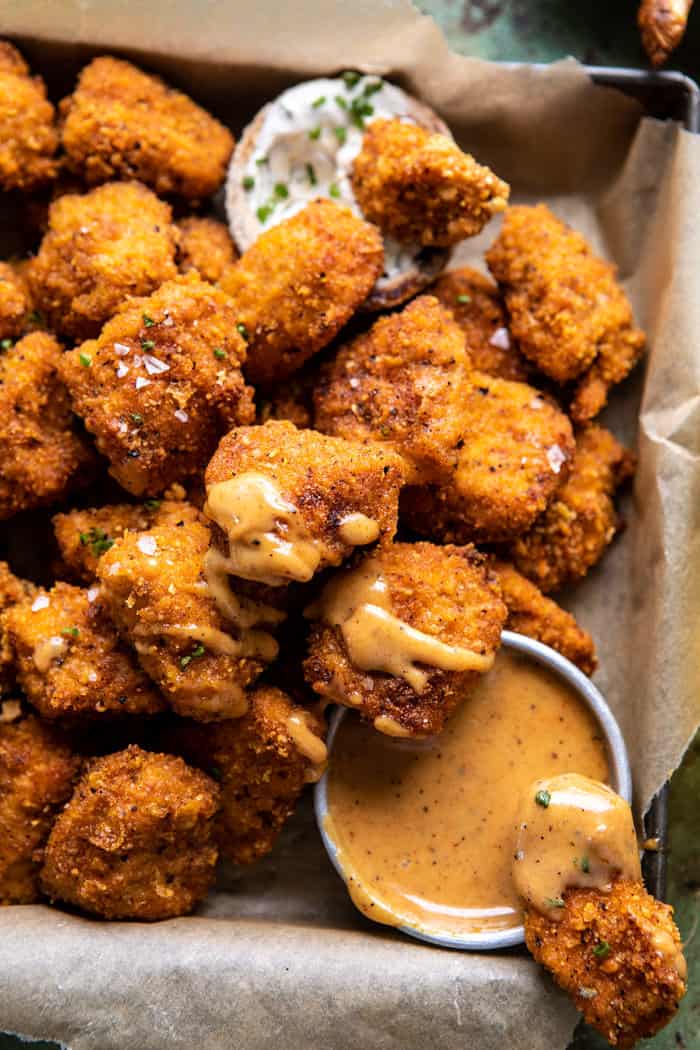 side angled close up photo of Oven Fried Cajun Popcorn Chicken with Creamy Honey Mustard 