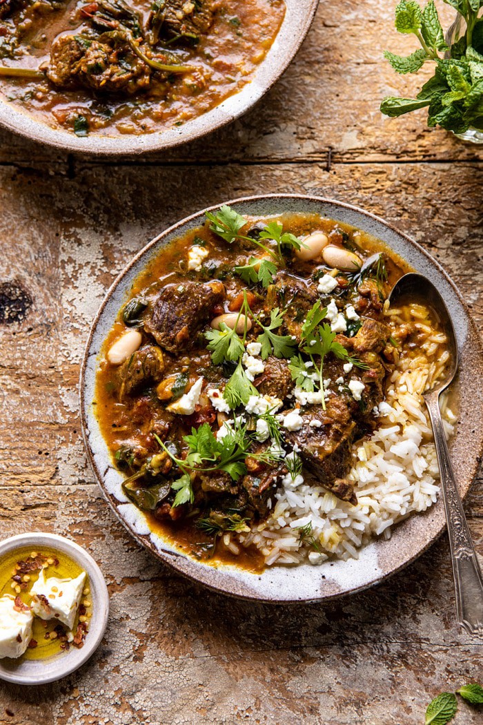 overhead close up photo of Persian Herb and Beef Stew with spoon in bowl