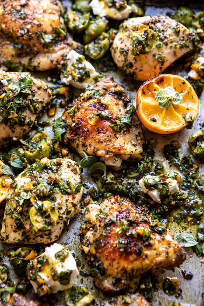 close up overhead photo of Roasted Garlic Butter Chicken with Lemon Olive Dressing on sheet pan