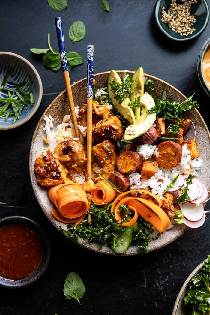 overhead photo of Sheet Pan Korean Chicken Bowl with Sweet Potatoes and Yum Yum Sauce with chop sticks in bowl 