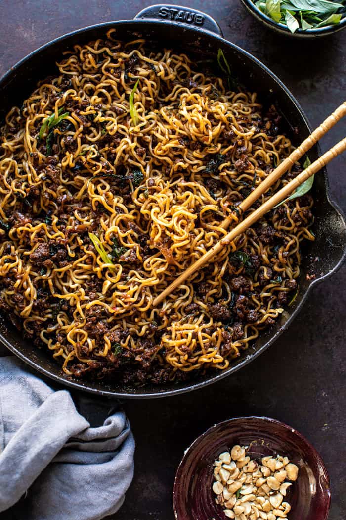 overhead photo of 30 Minute Caramelized Shallot Beef Ramen Noodles in skillet with chopsticks