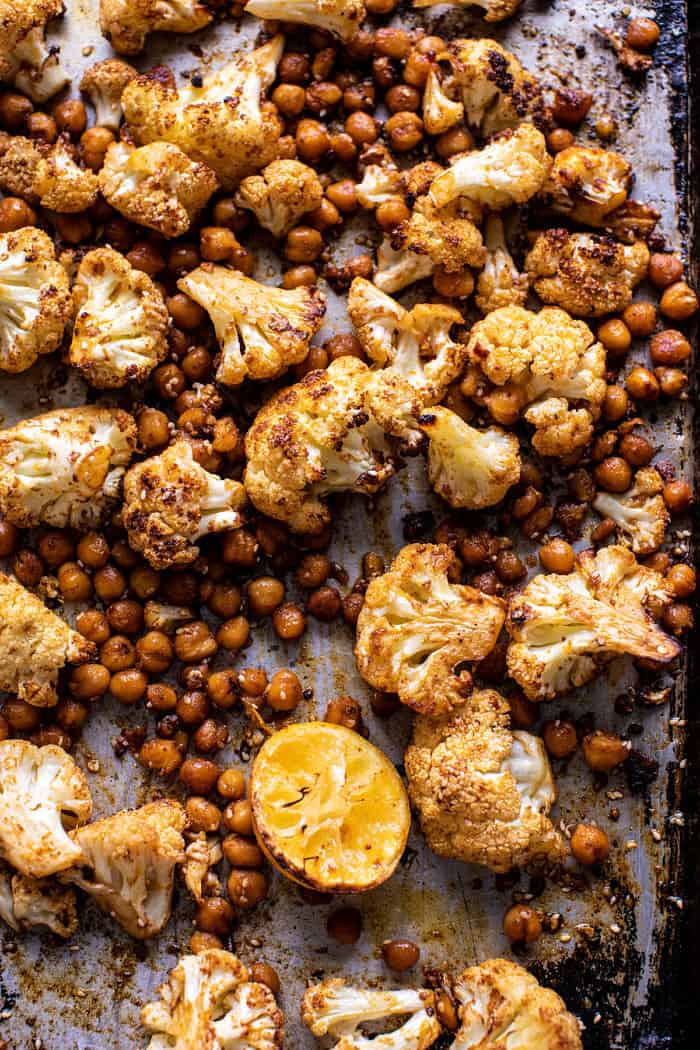Cauliflower and chickpeas on baking sheet after roasting
