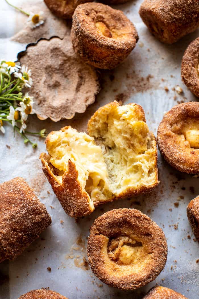 overhead photo of Cinnamon Sugar Brown Butter Popover broken in half to expose the center of the popover