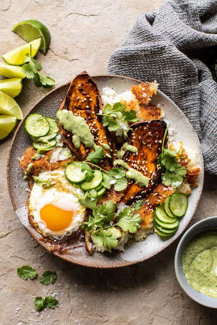 overhead photo of Crispy Rice Bowl with Browned Butter Sweet Potatoes and Herby Green Tahini 