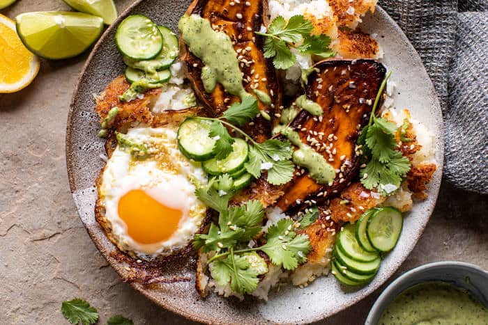 overhead horizontal photo of Crispy Rice Bowl with Browned Butter Sweet Potatoes and Herby Green Tahini 