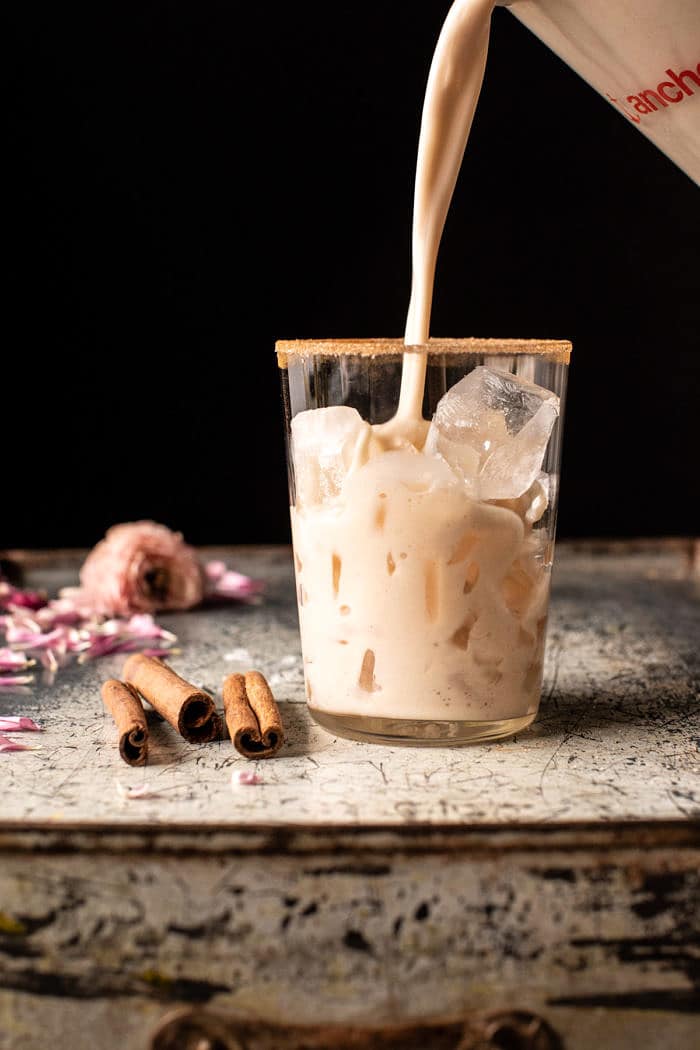 pour photo of Dirty Horchata being poured over ice