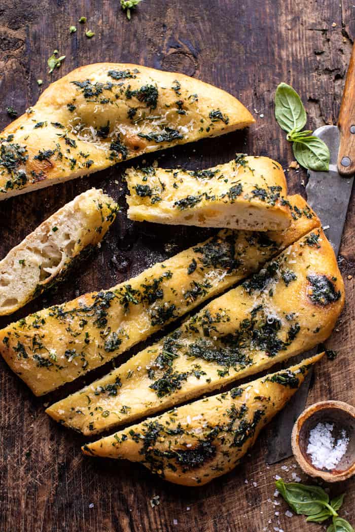 overhead photo of No Knead Rosemary Garlic Parmesan Bread with bread sliced 