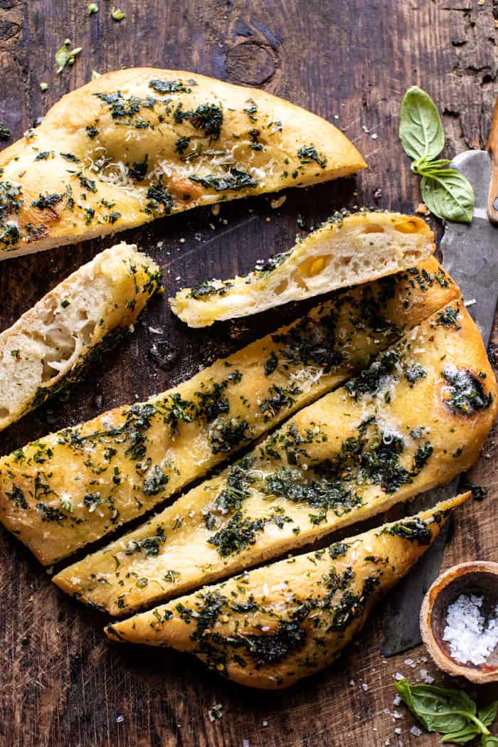 overhead photo of No Knead Rosemary Garlic Parmesan Bread with bread slices cut