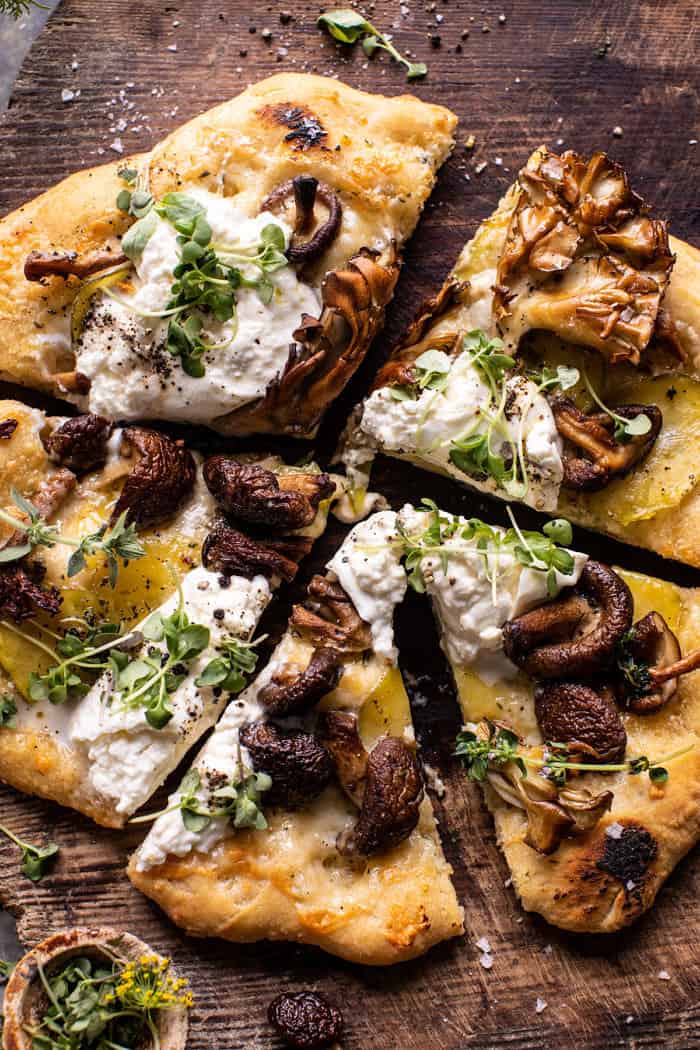 overhead close up photo of Potato and Wild Mushroom Burrata Pizza with pizza cut into slices