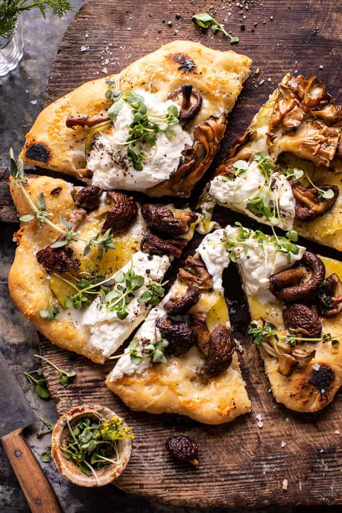 overhead photo of Potato and Wild Mushroom Burrata Pizza with pizza cut into slices 
