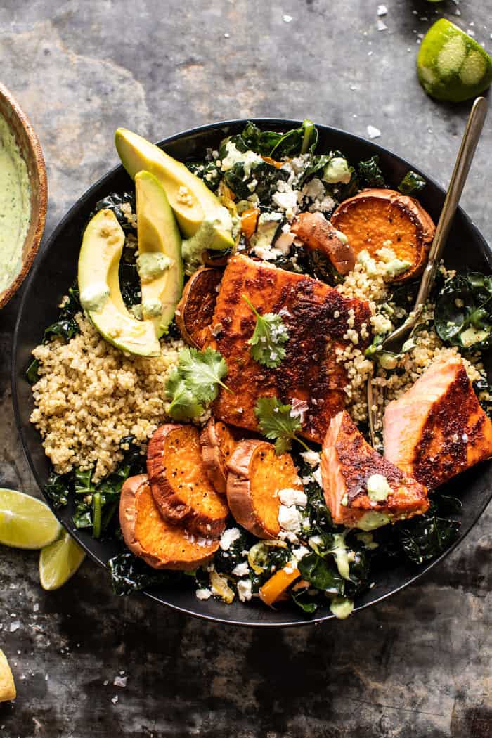 overhead photo Sheet Pan Chipotle Salmon with Cilantro Lime Special Sauce with fork in bowl
