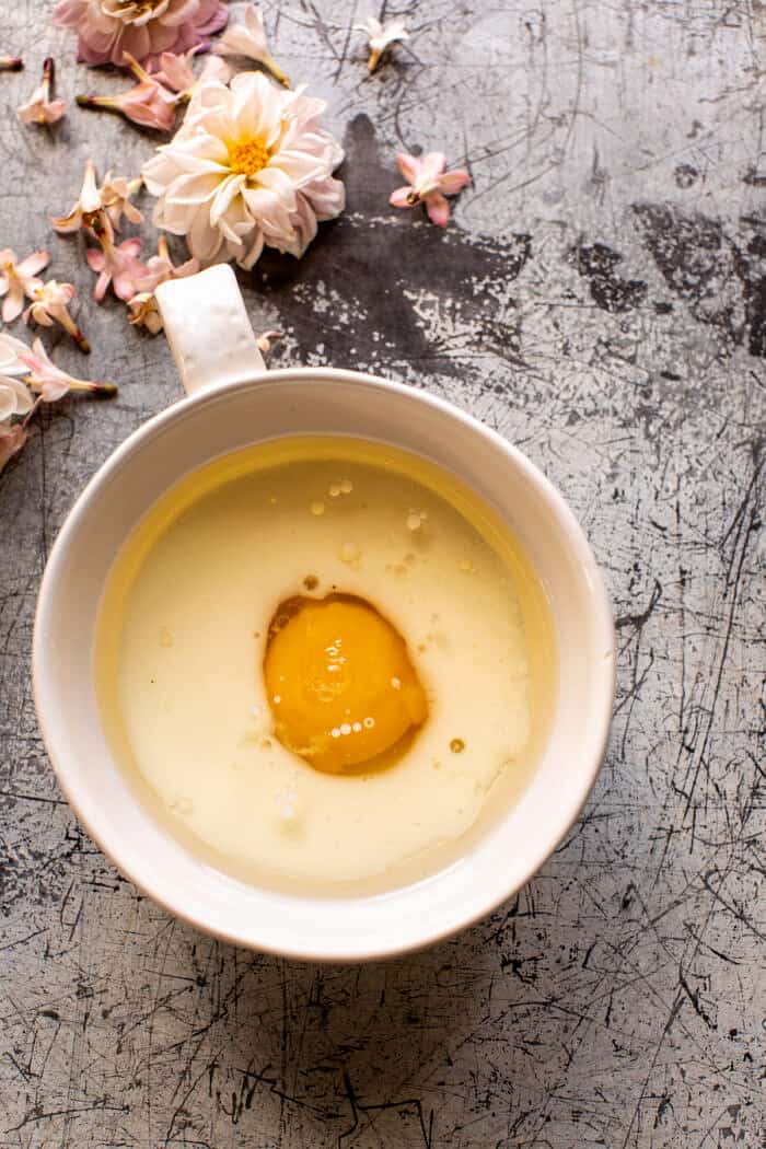 overhead prep photo of egg in mug before baking 