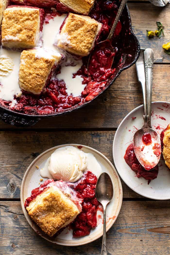 overhead photo of Skillet Strawberry Bourbon Cobbler with Layered Cream Cheese Biscuits on plate