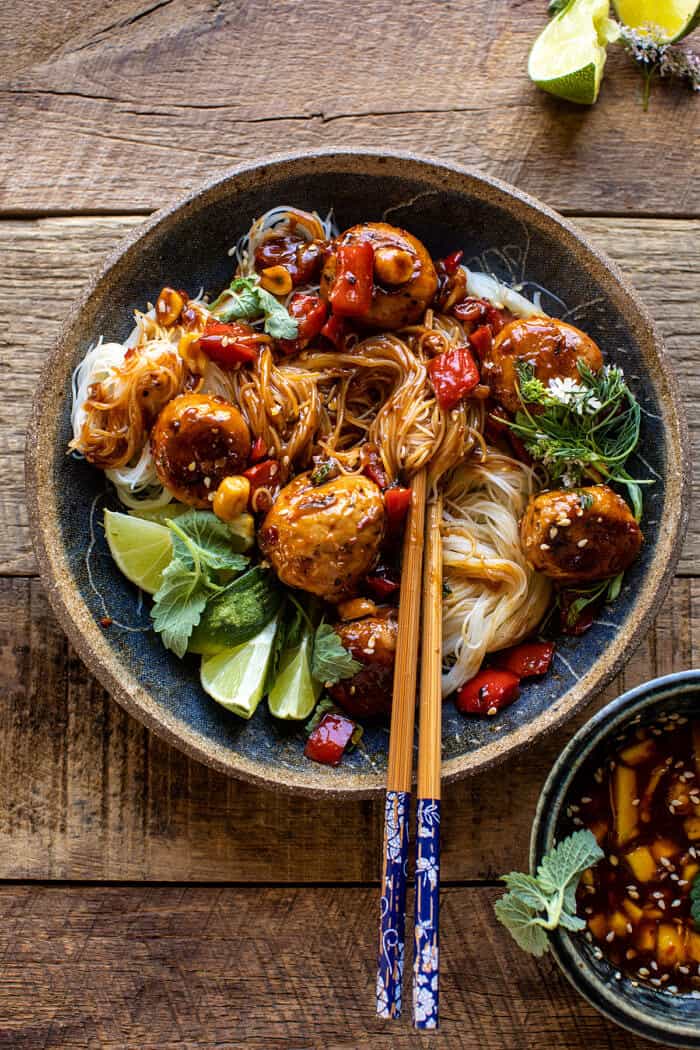 overhead photo of 30 Minute Sticky Thai Meatballs with Sesame Noodles with chopsticks in bowl