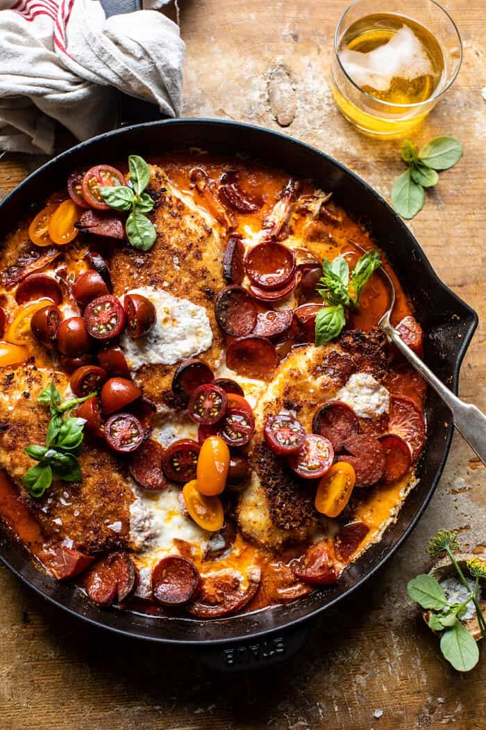 overhead photo of Skillet Cheesy Pepperoni Pizza Chicken with spoon in chicken