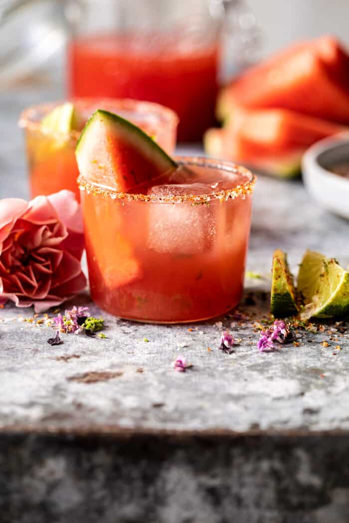 side angle photo of Watermelon Rosè Paloma with watermelon wedge in drink
