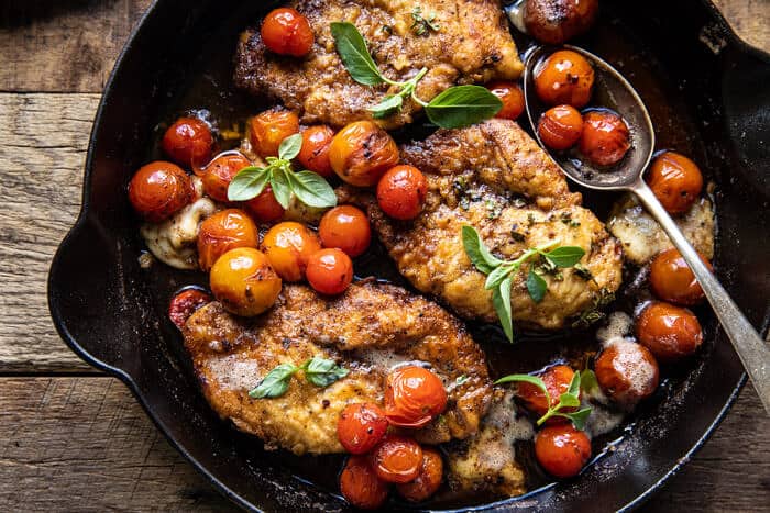 overhead horizontal photo of 20 Minute Florentine Butter Chicken with Burst Cherry Tomatoes