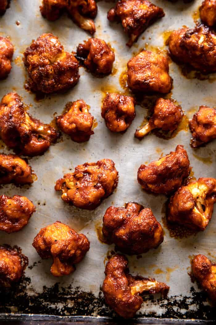 overhead photo of Crispy Beer Battered BBQ Cauliflower Nuggets on baking sheet after baking 