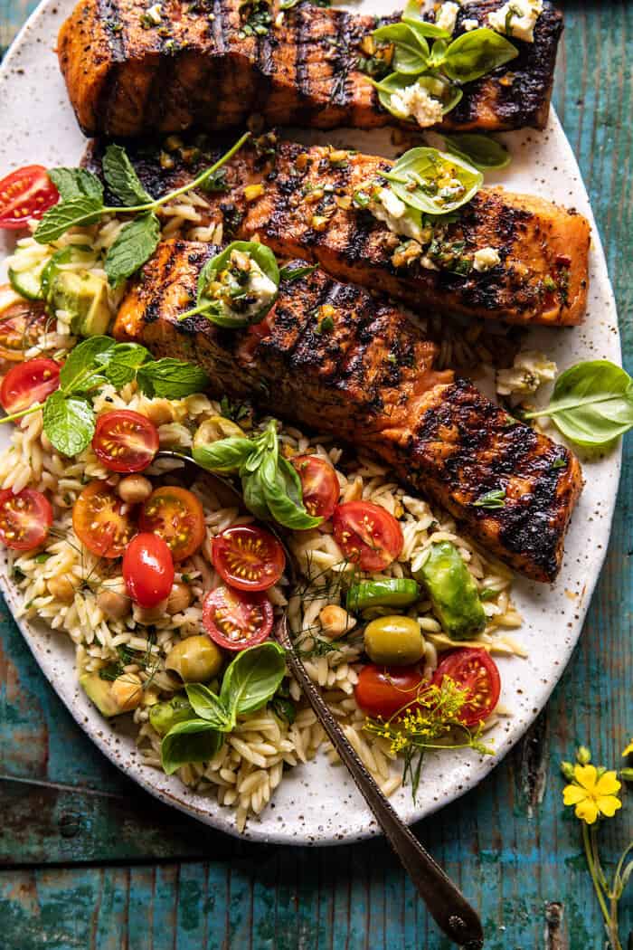 overhead close up photo of Greek Salmon with Lemon Feta and Orzo Summer Salad | halfbakedharvest.com