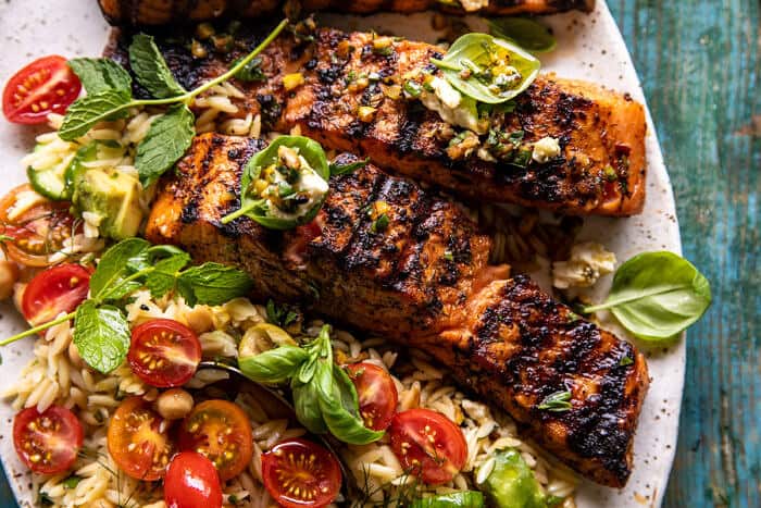 overhead horizontal photo of Greek Salmon with Lemon Feta and Orzo Summer Salad