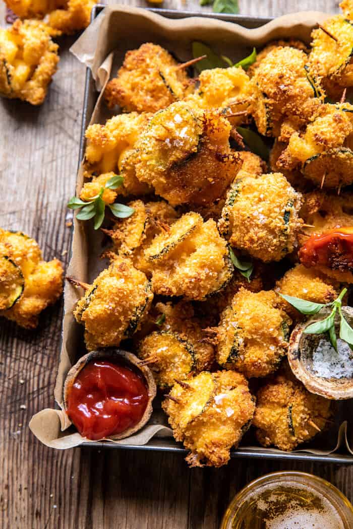 side photo of Mac and Cheese Stuffed Oven Fried Zucchini Bites in serving basket