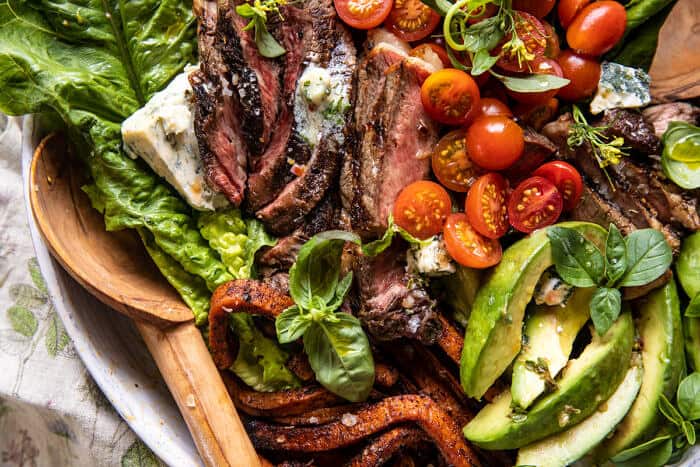 overhead horizontal photo of Sweet Potato Fry Steak Salad with Blue Cheese Butter