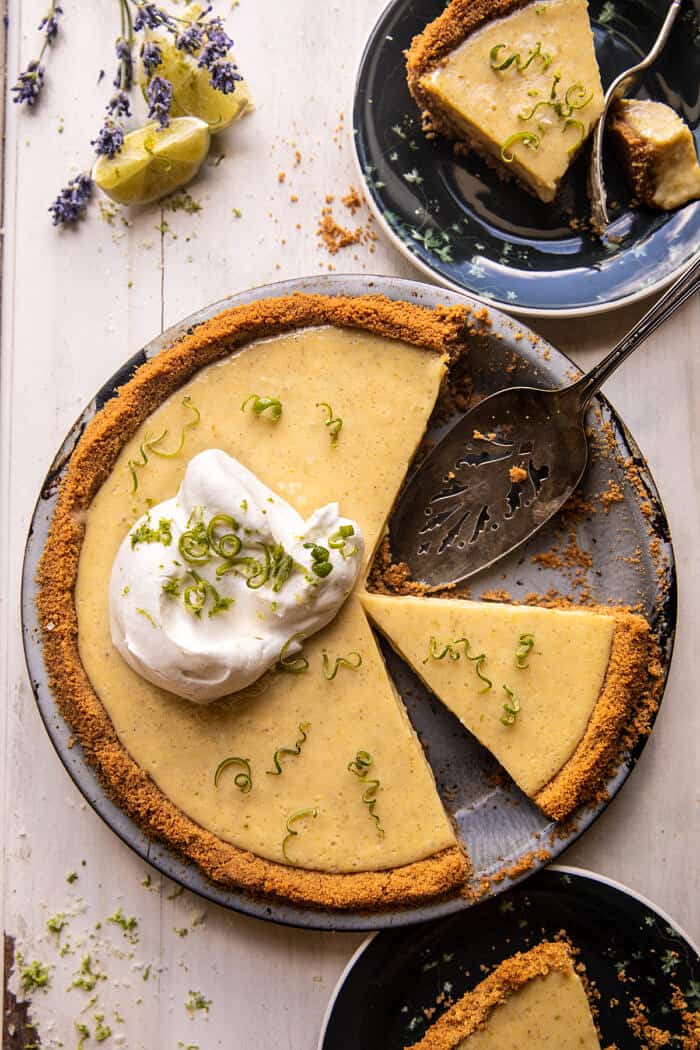 overhead photo of Double Stuffed Vanilla Key Lime Pie with spoon in pie plate 