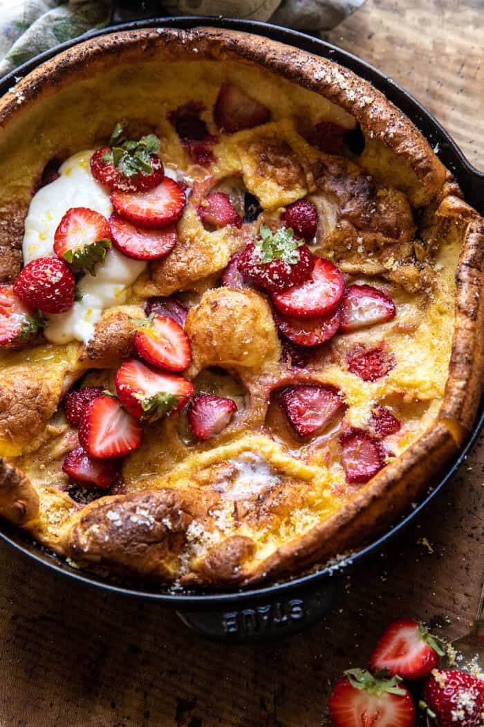 side angle view of Lemon Strawberry Dutch Baby with Ricotta Cream