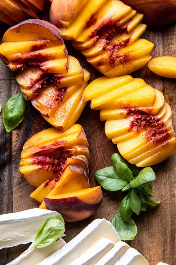 raw peaches on cutting board