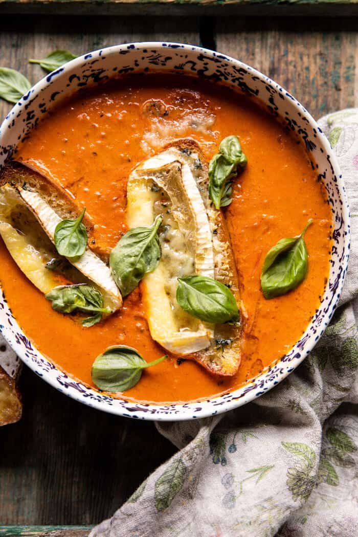 overhead close up photo of Easiest Herby Tomato Soup with Melted Brie Crostini