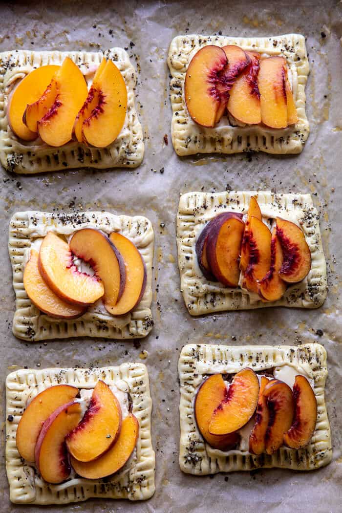 overhead photo of Peach Brie Pastry Tarts on baking sheet before baking