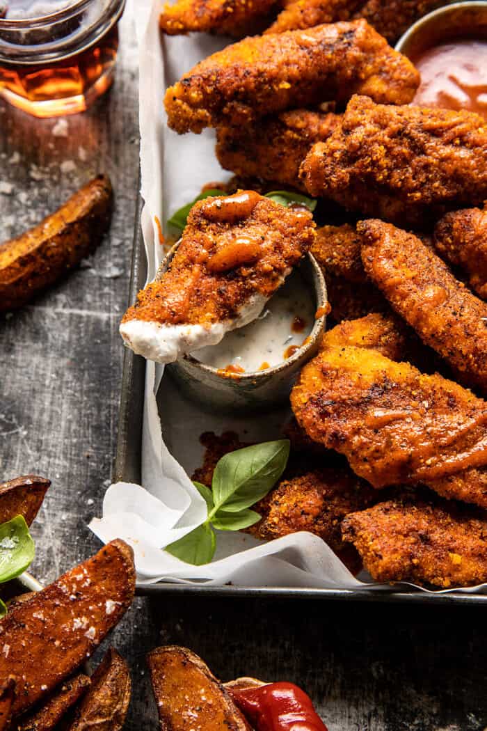 side angled close up photo of Black Pepper Rub Chicken Fingers with Greek Yogurt Ranch 