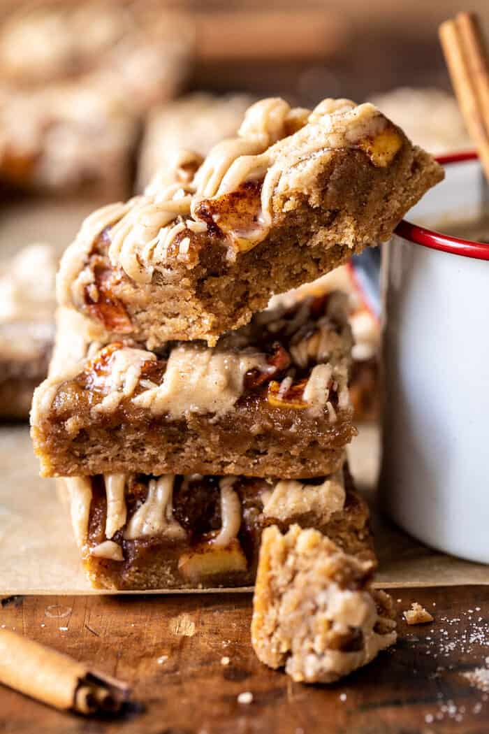 side angle photo of Brown Butter Apple Blondies with Cinnamon Maple Glaze stacked one on top of the other