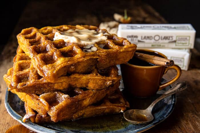 side angle horizontal photo of Cider Pumpkin Waffles with Salted Maple Butter