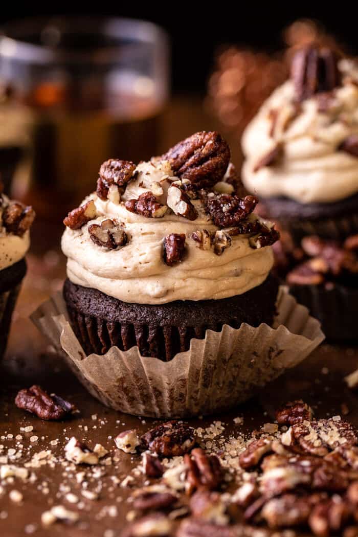 side angled photo of Chocolate Bourbon Pecan Pie Cupcakes with Butter Pecan Frosting