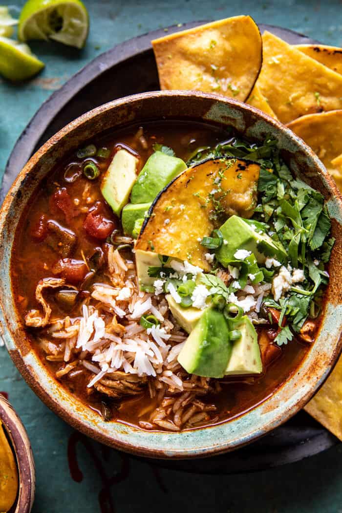 Slow Cooker Chipotle Chicken and Avocado Rice Soup | halfbakedharvest.com overhead close up photo of Slow Cooker Chipotle Chicken and Avocado Rice Soup