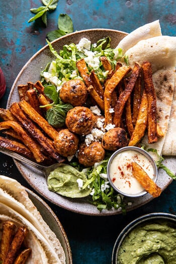 Chicken Meatball Pita Bowls with Seasoned Fries and Feta.
