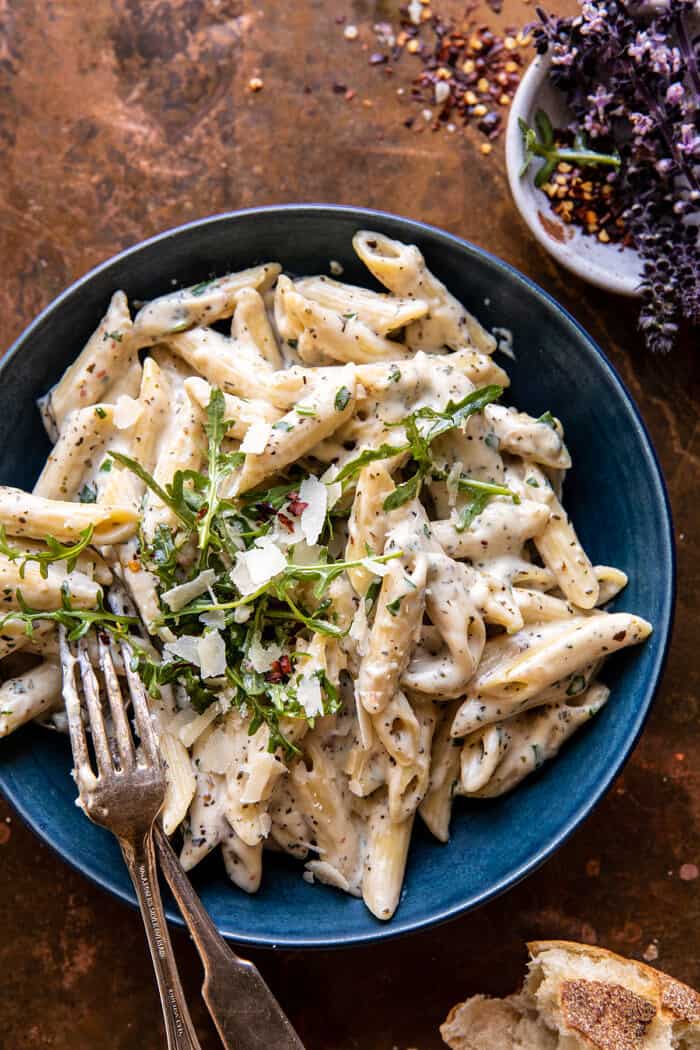 overhead photo of One Pot Creamy Penne Alfredo with Spicy Arugula 