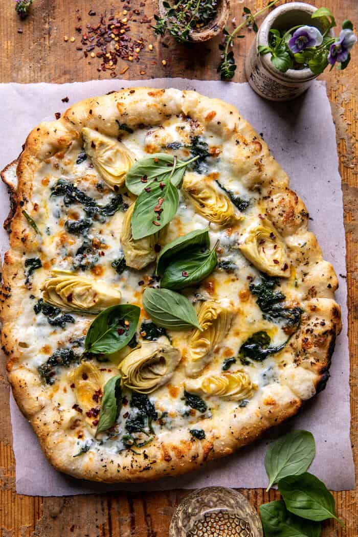 Spinach and Artichoke Pizza with Cheesy Bread Crust | halfbakedharvest.com